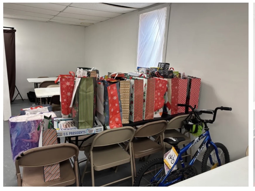 Wrapped Christmas gifts and toys lined up on tables for holiday distribution